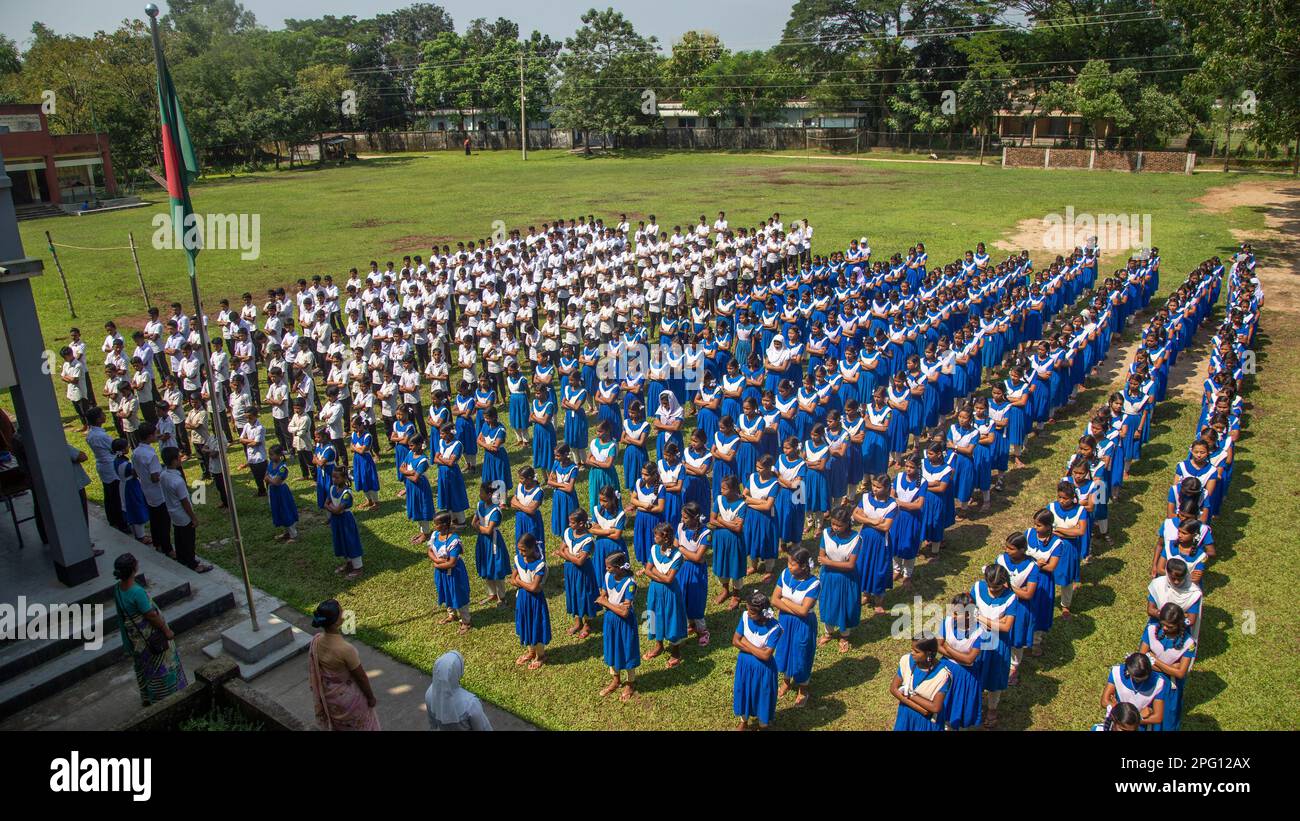 'Future leaders rise, as Bangladesh's national anthem fills the hearts of school students.' Photo Credit: Ripon Abraham Tolentino. RVA News Stock Photo