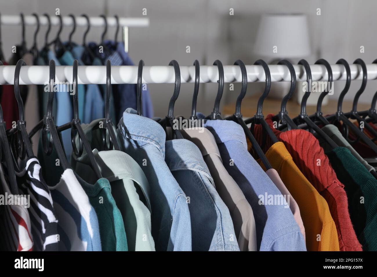 Rack with stylish clothes indoors, closeup. Fast fashion Stock Photo - Alamy