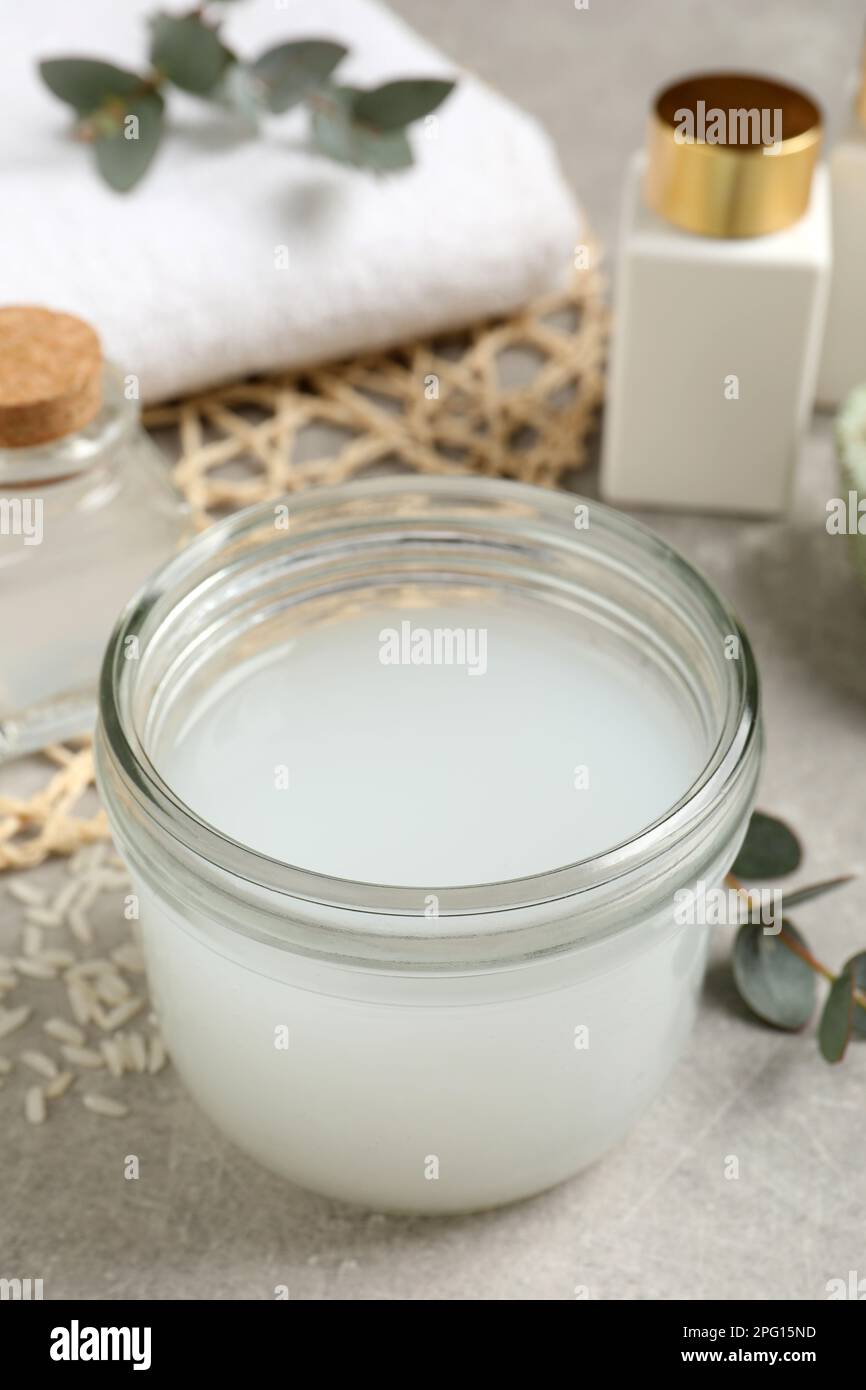 Homemade natural rice water on light grey table Stock Photo - Alamy