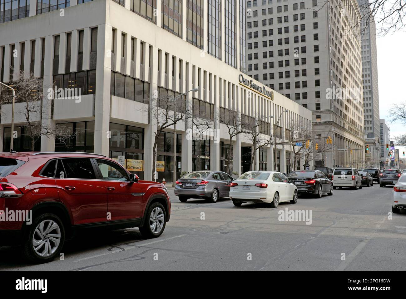 Automobile traffic moves southbound along East 9th Street in downtown Cleveland, Ohio as it passes the Ohio Savings Plaza on February 21, 2023. Stock Photo
