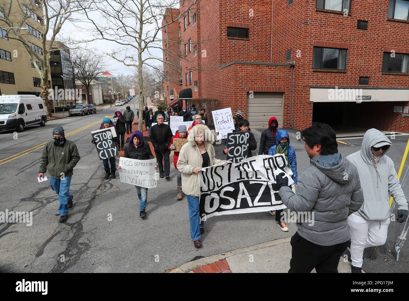 State College, United States. 19th Mar, 2023. People hold a banner and ...