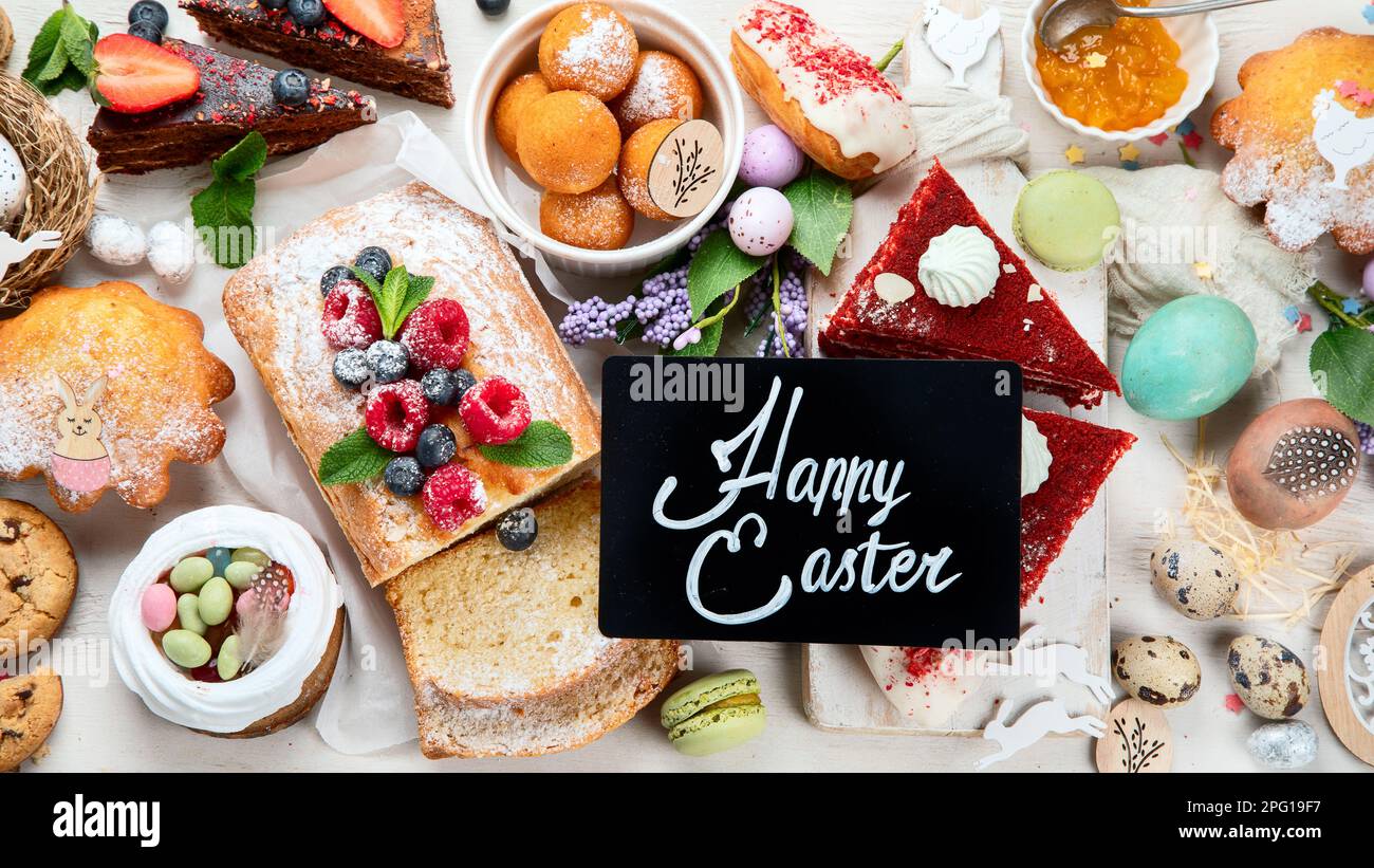 Easter desserts  table.  Sweet easter holiday concept with holiday decorations. Top view Stock Photo