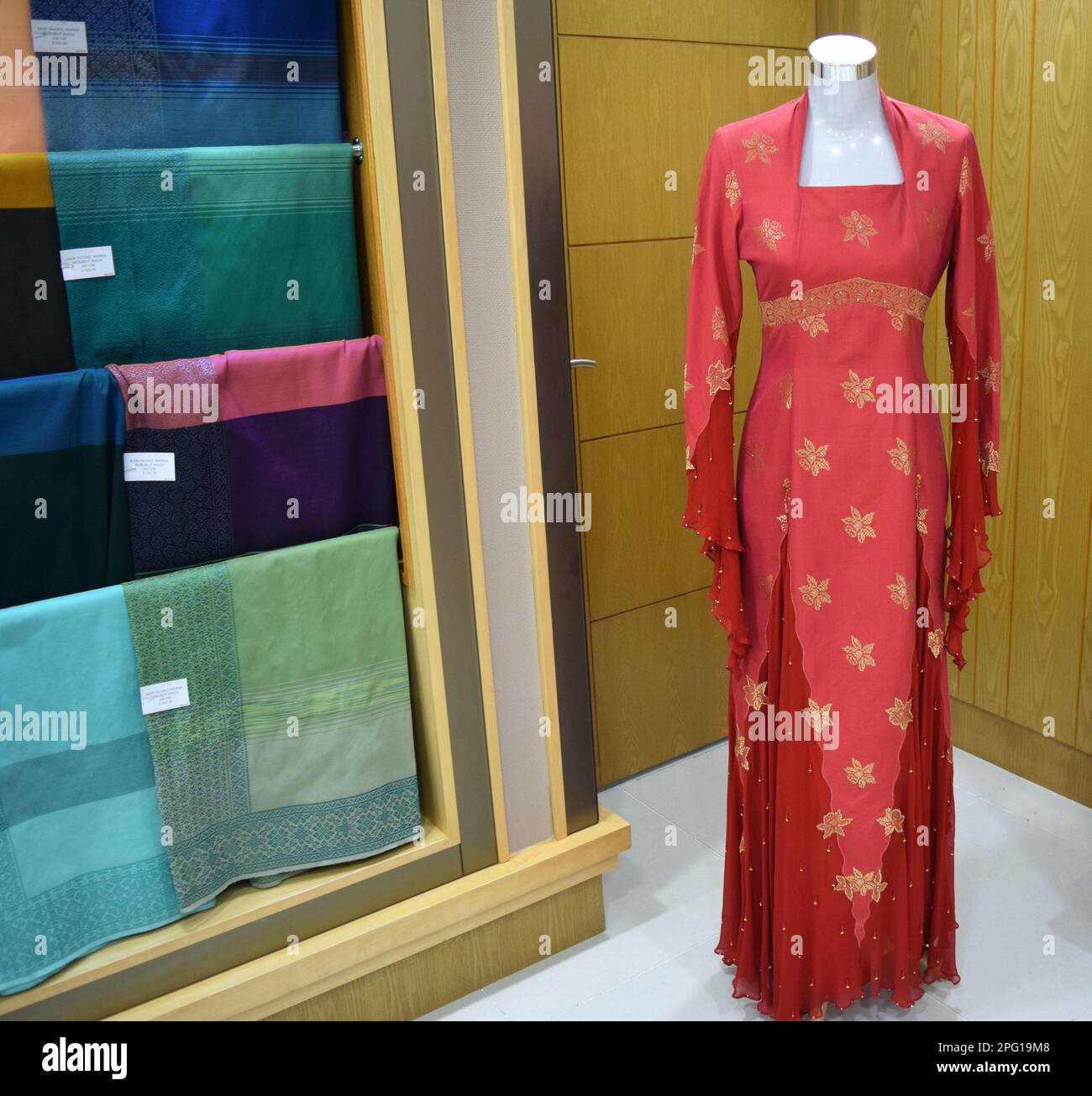 Brunei traditional womens dress and fabrics Stock Photo - Alamy