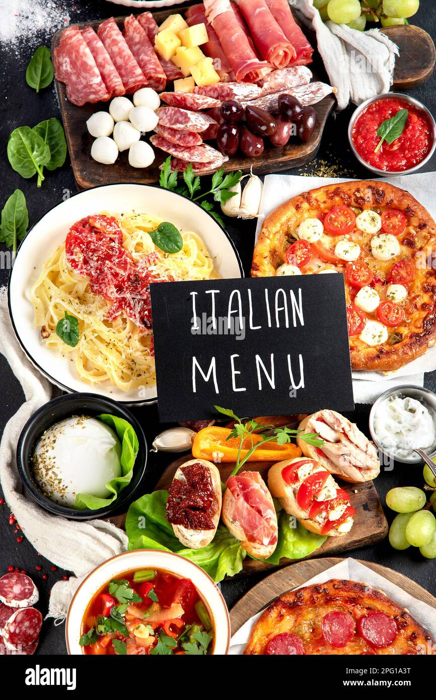 Italian food dishes on dark background. Traditional italian cuisine  concept. Dishes and appetizers of indeed cuisine. Mideterranean diet food high in Stock Photo