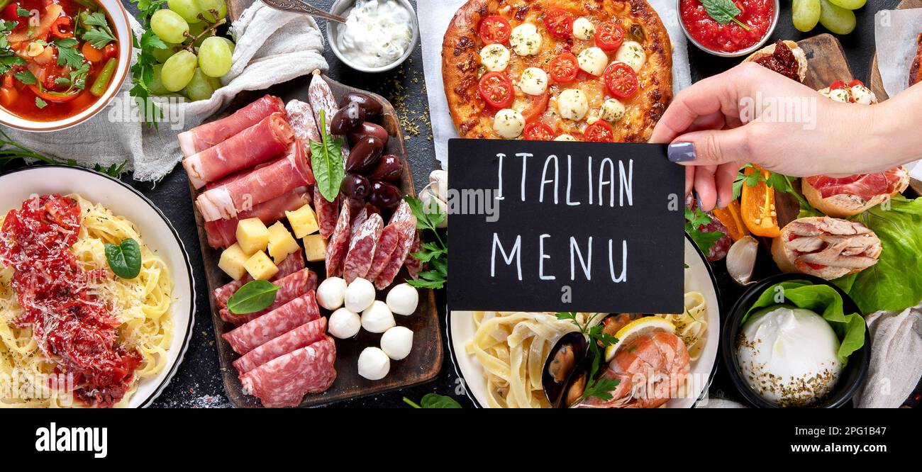 Italian food dishes on dark background. Traditional italian cuisine  concept. Dishes and appetizers of indeed cuisine. Mideterranean diet food high in Stock Photo