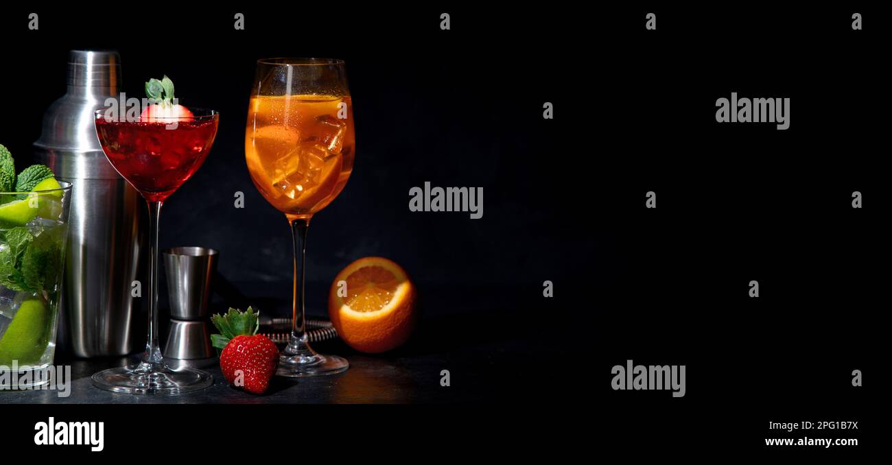 Set of various colorful cocktails on black background. Classic long drink cocktails menu concept. Copy, space Stock Photo