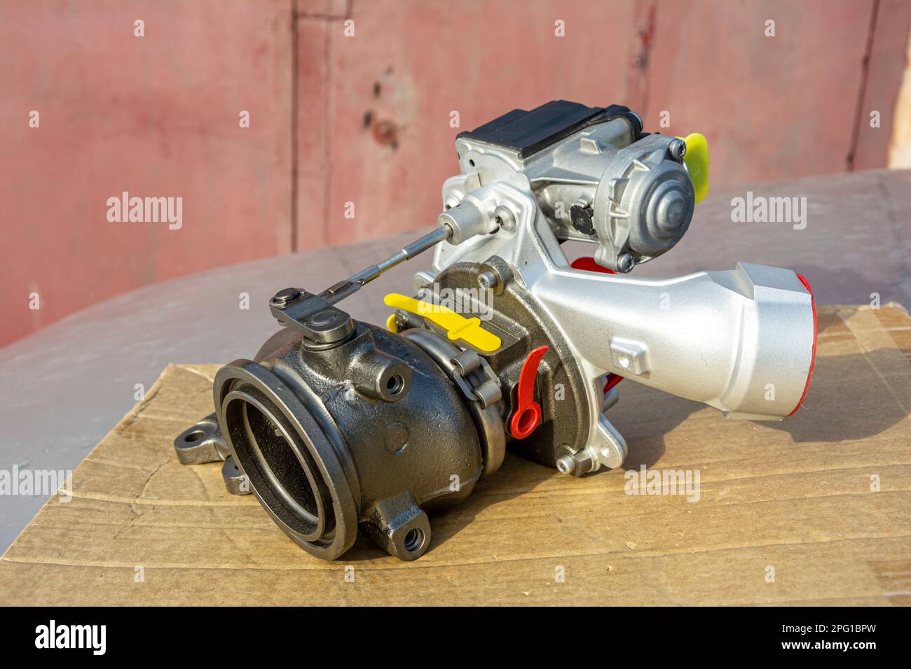 new turbine for an automobile engine lies on the hood of the car Stock