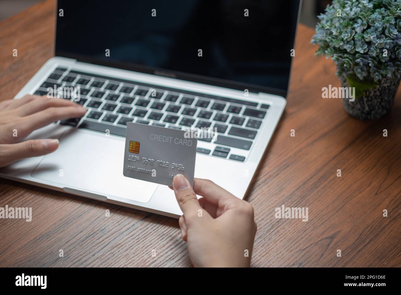woman using laptop shopping purchasing online, paying by credit card