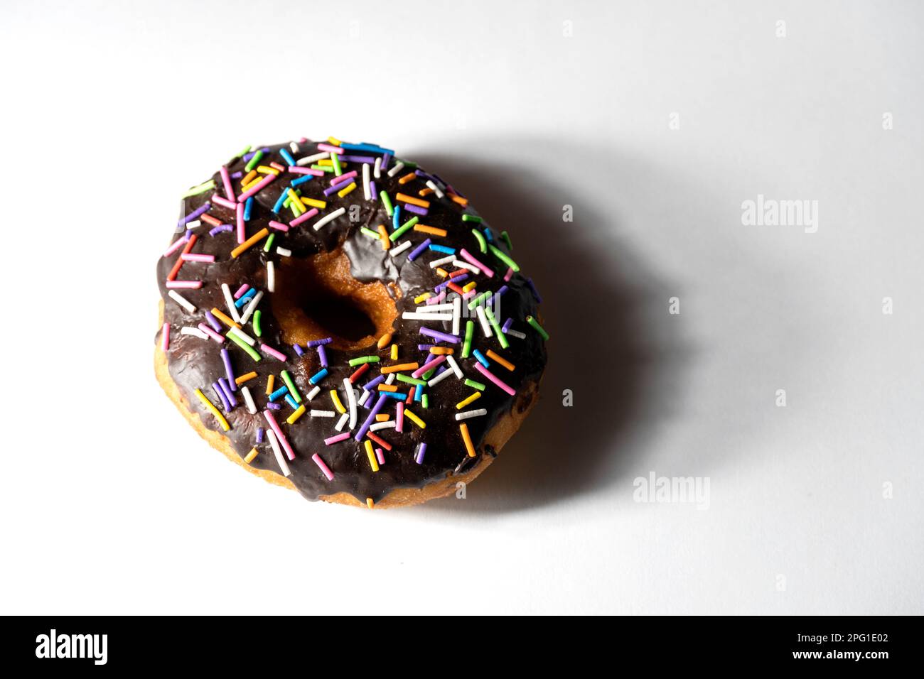 Colourful donuts on white background. Top view Stock Photo