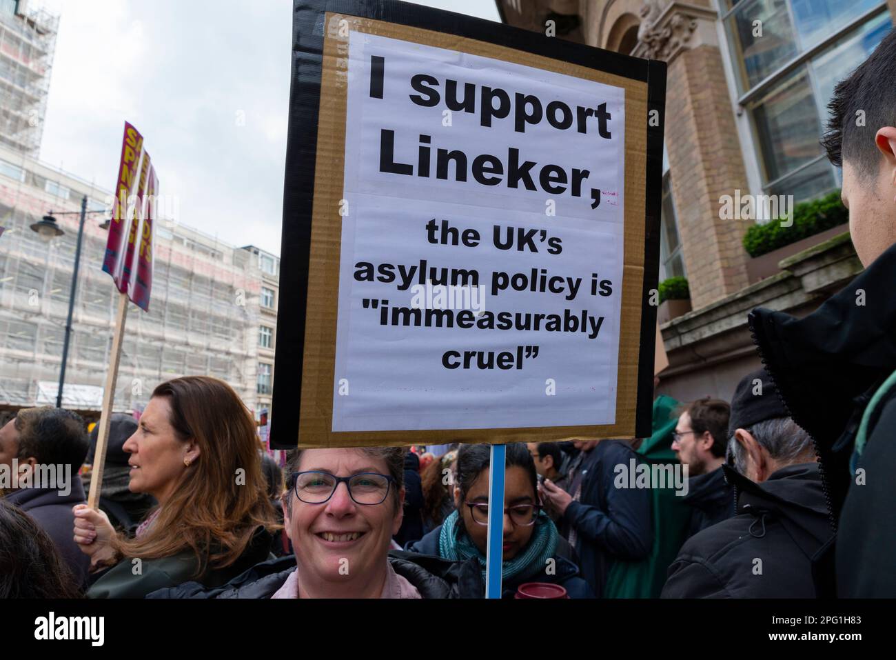 Protest taking place in London on UN Anti Racism Day. Stand up to Racism. Placard in support of Gary Lineker, quoting immeasurably cruel policy Stock Photo