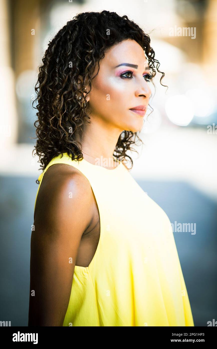 Beautiful woman looking away outdoors Stock Photo Alamy