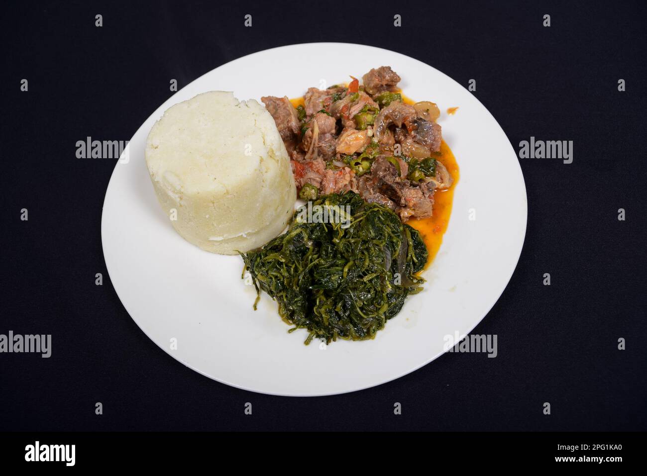 beef stew served with African ugali and kienyeji vegetables. Beef stew