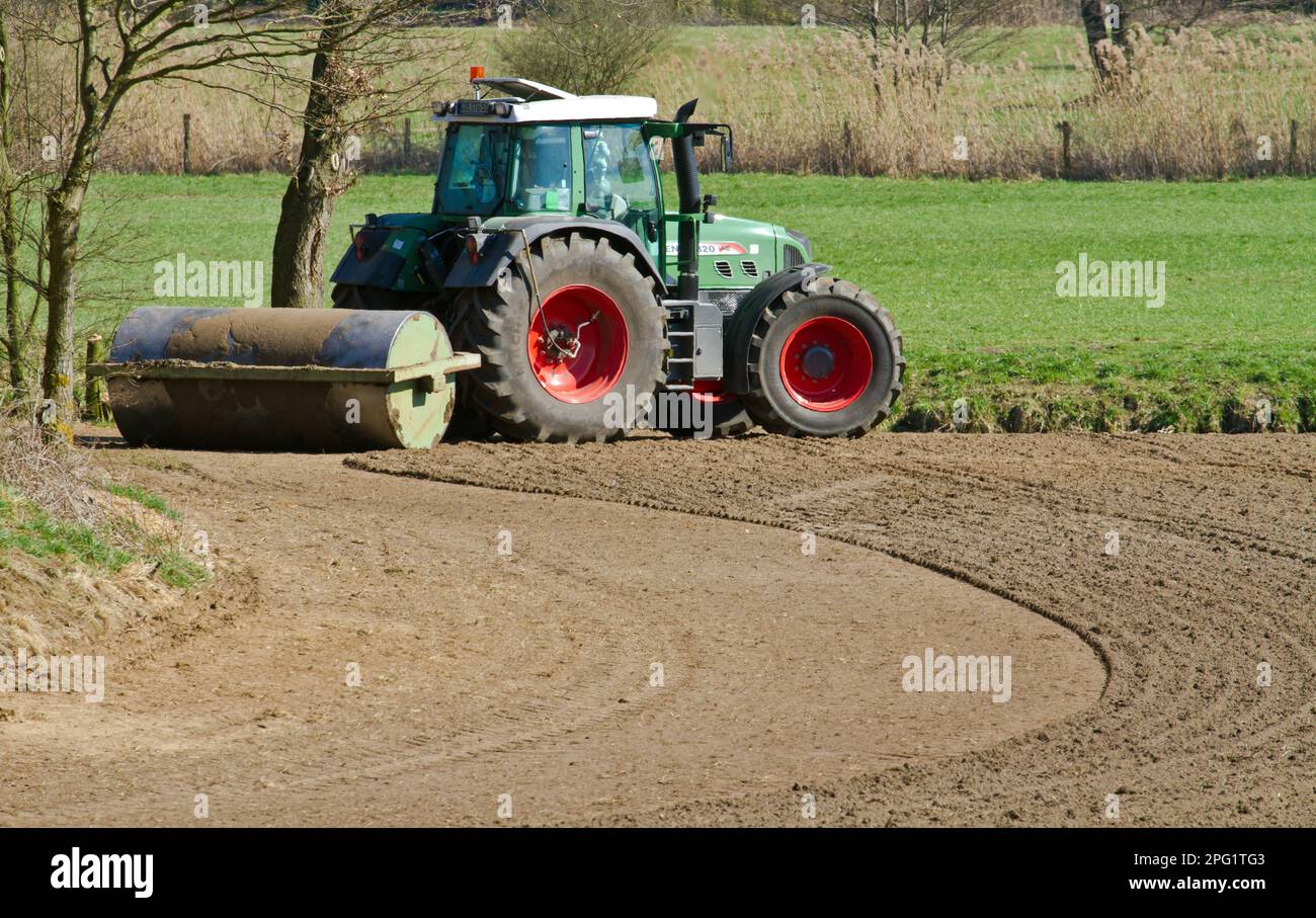 Tractor with agricultural machinery,roller, Germany Stock Photo Alamy