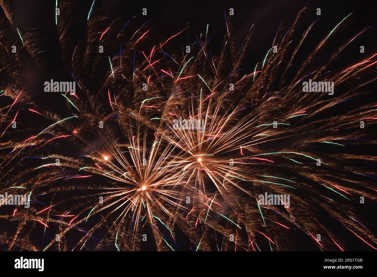 abstract holiday background: plenty of multicolor fireworks in night ...