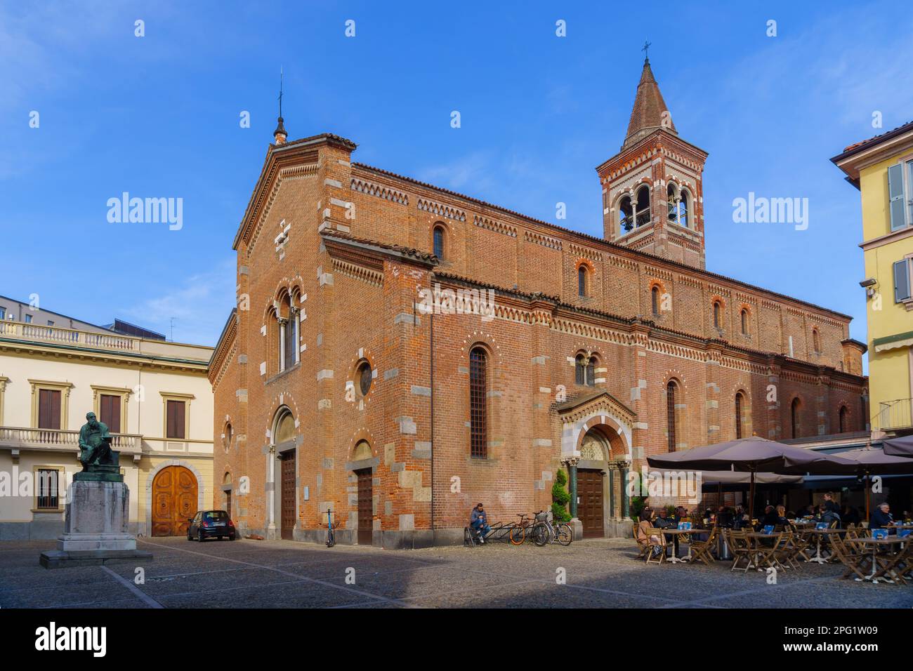Monza, Italy - February 25, 2023: View of the San Pietro Martire church, with its piazza and visitors, in Monza, Lombardy, Northern Italy Stock Photo