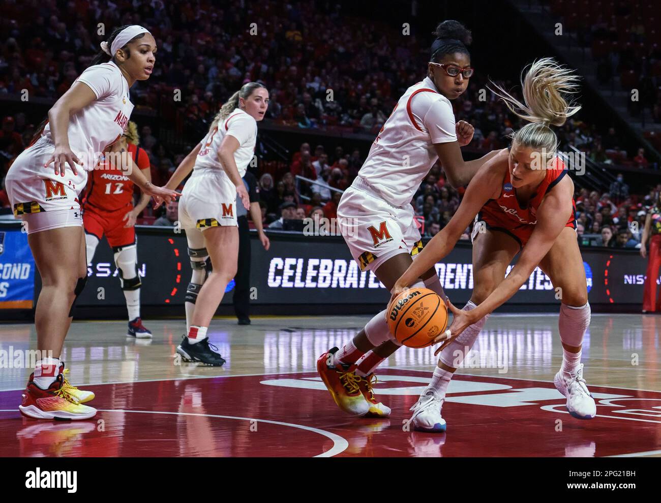 COLLEGE PARK, MD - MARCH 19: Maryland Terrapins guard Shyanne Sellers (0) watches as Arizona Wildcats forward Cate Reese (25) collects a loose ball during the Arizona Wildcats game versus the Maryland Terrapins game in the second four of the NCAA Women's Basketball Championship Greenville Regional 1 on March 19, 2023 at Xfinity Center in College Park, MD. (Photo by Tony Quinn/Icon Sportswire) (Icon Sportswire via AP Images) Stock Photo