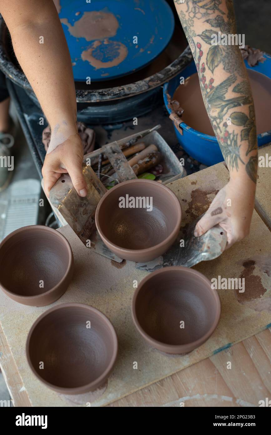 Hands crafting a pot on pottery wheel Stock Photo Alamy