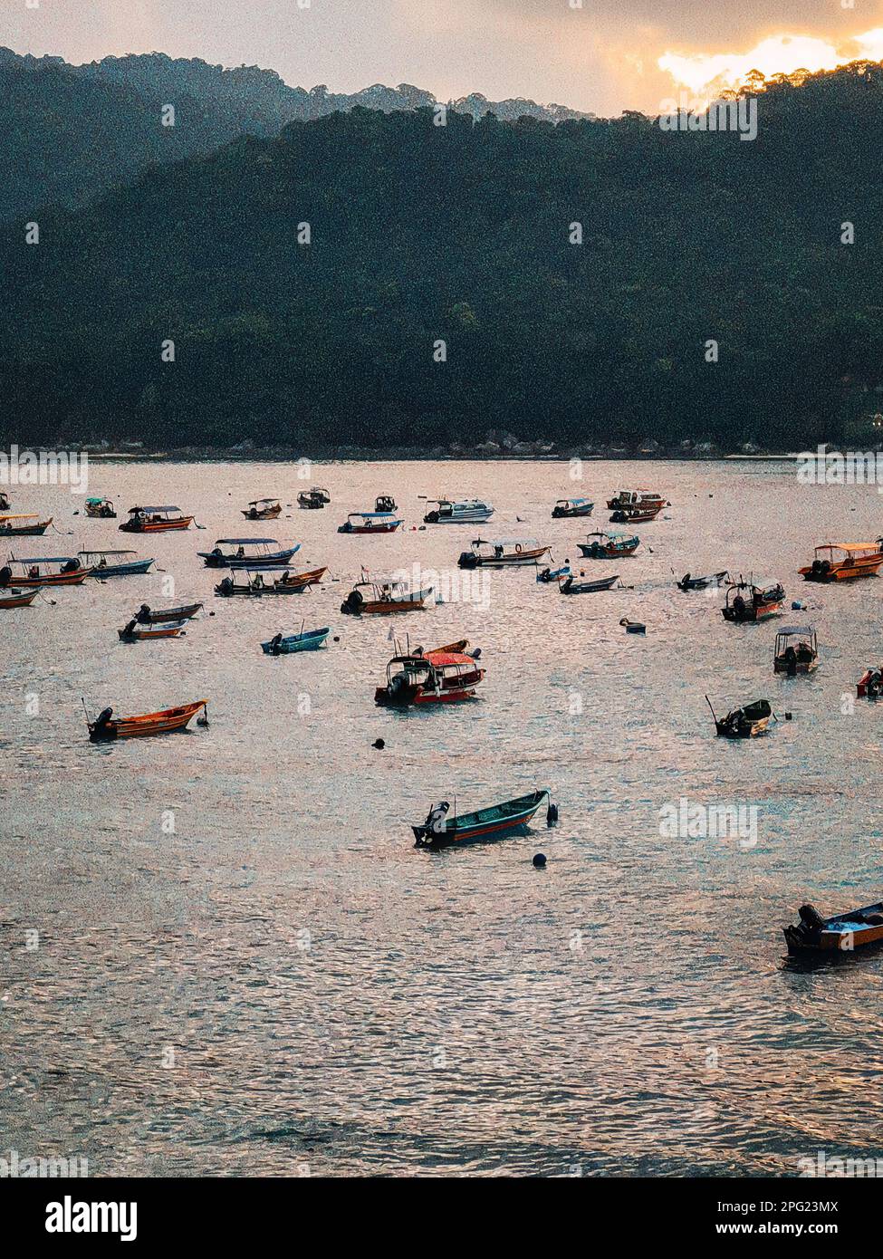 Colourful boats floating during sunrise in Perhentian Island
