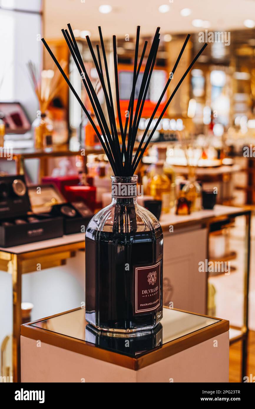Diffusers In Malls Black glass bottle with wood stick aroma diffusers on mirror stand in ...