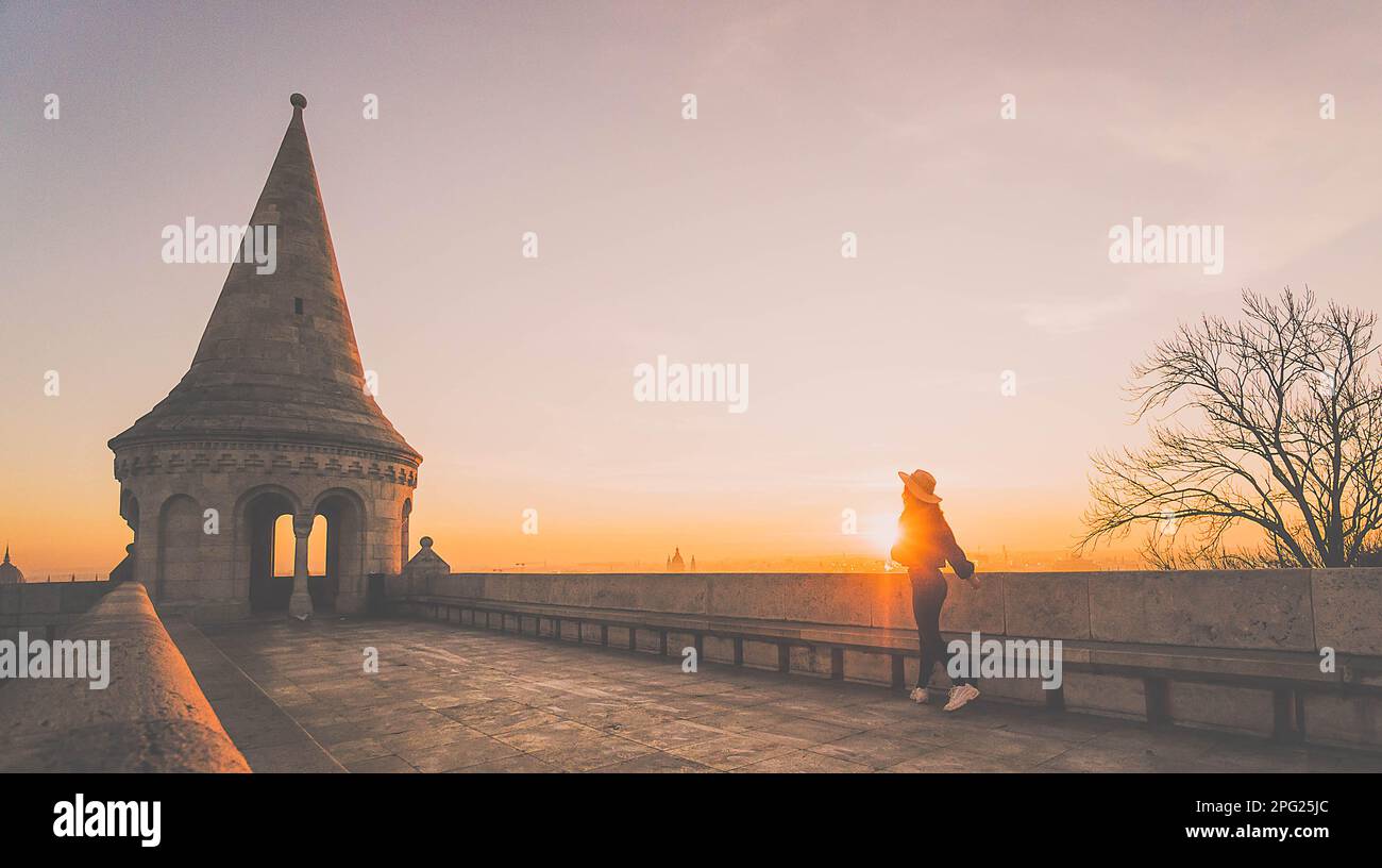 girl with hat in corridor of a tower of Fisherman´s bastion at sunrise Stock Photo
