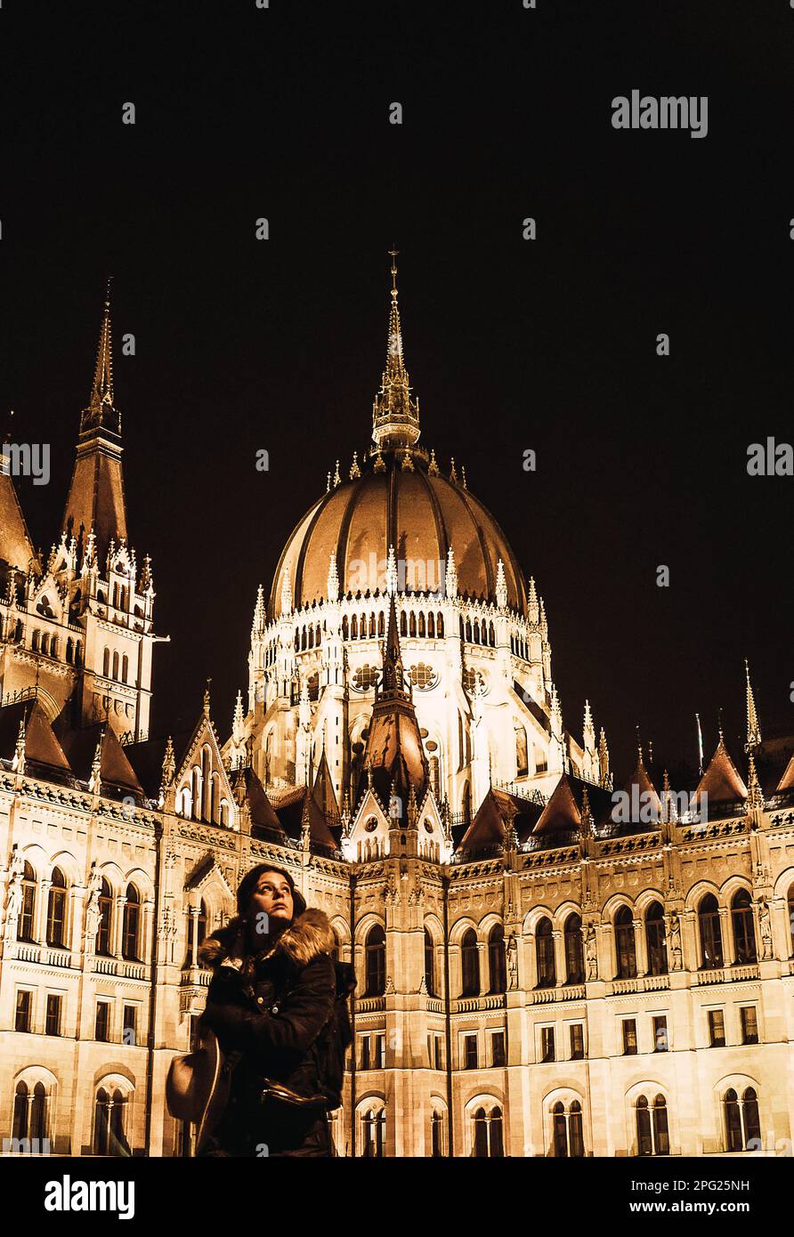 tourist girl looking the city on a side of parliament of Budapest Stock Photo