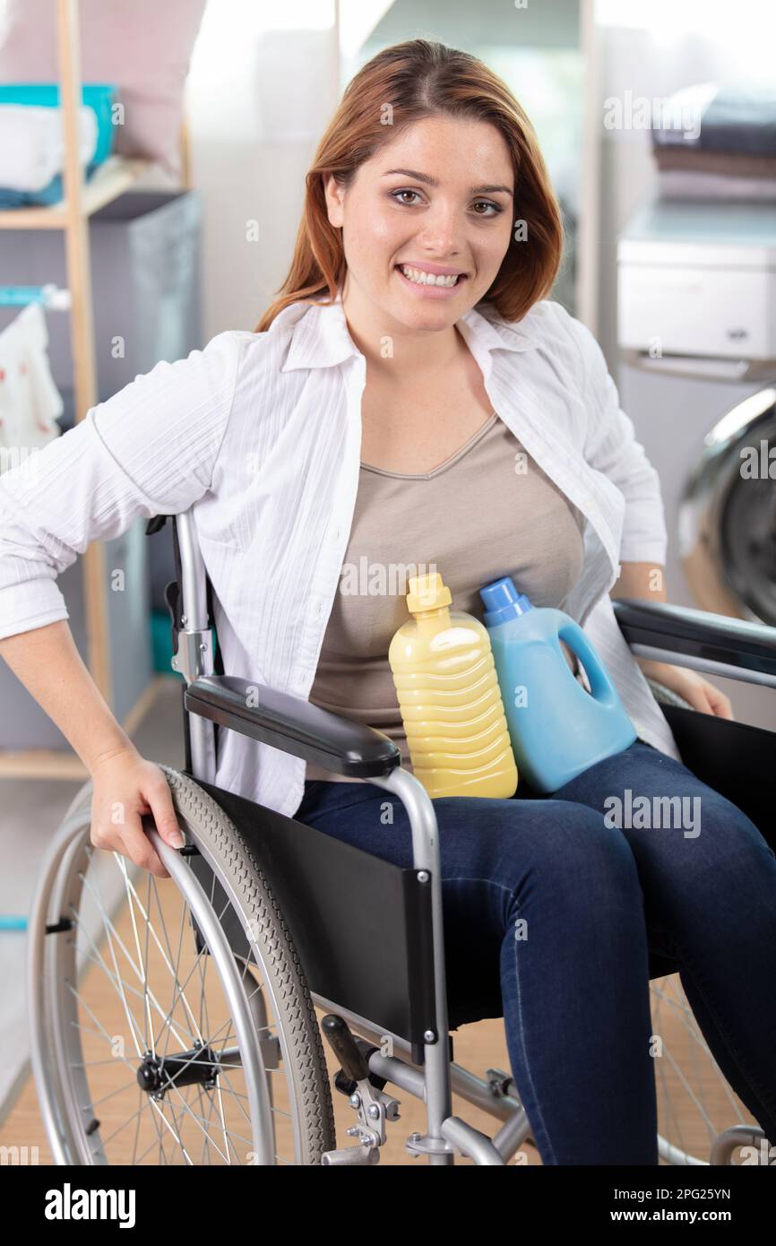 Woman in wheelchair cleaning hi-res stock photography and images - Alamy