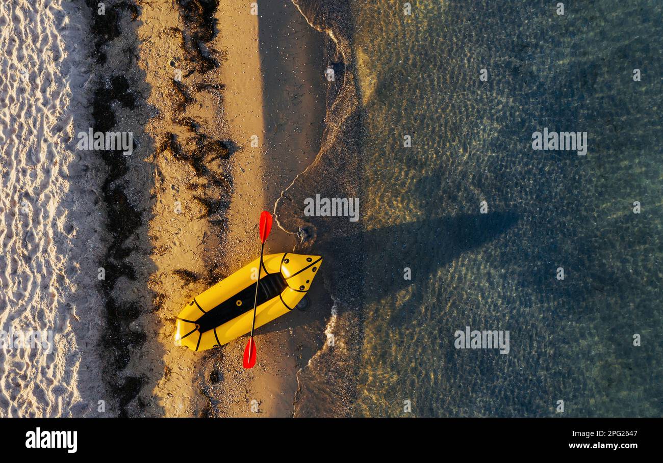 Top view of yellow boat that parked on the coast of ocean at daytime ...