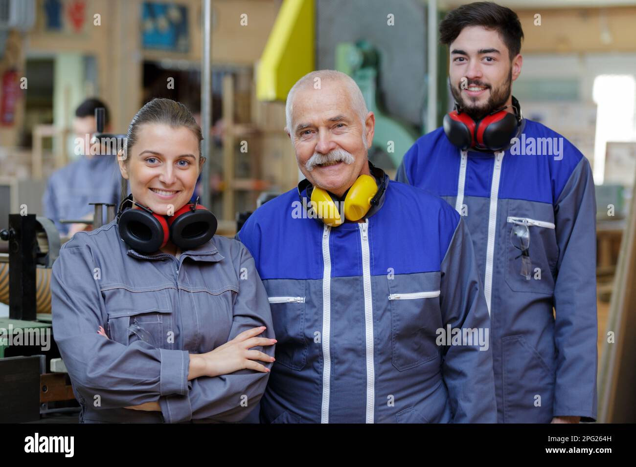 happy warehouse managers and worker standing together Stock Photo