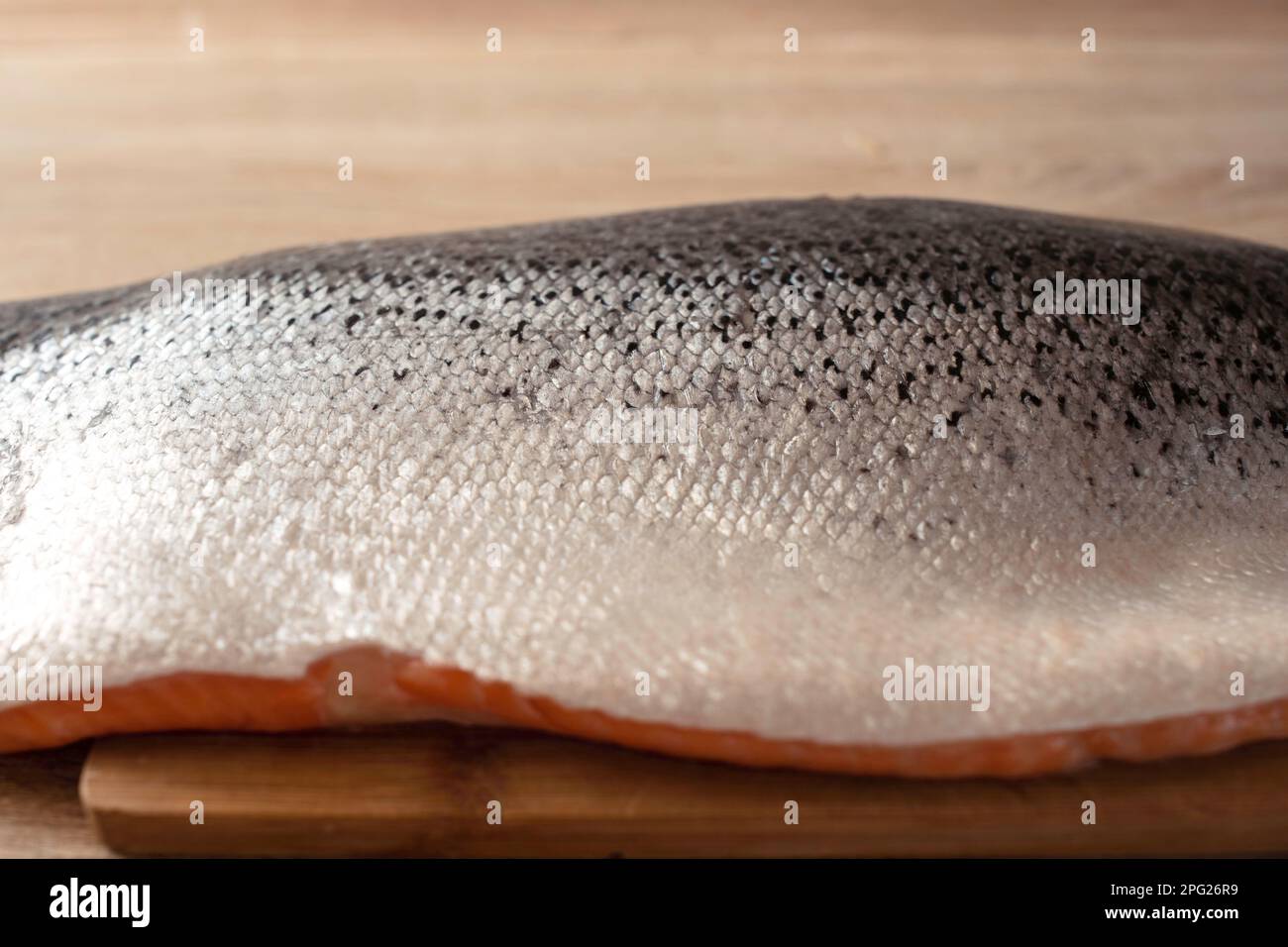 Fillet of fresh raw salmon or trout from sea fish on a cutting wooden ...