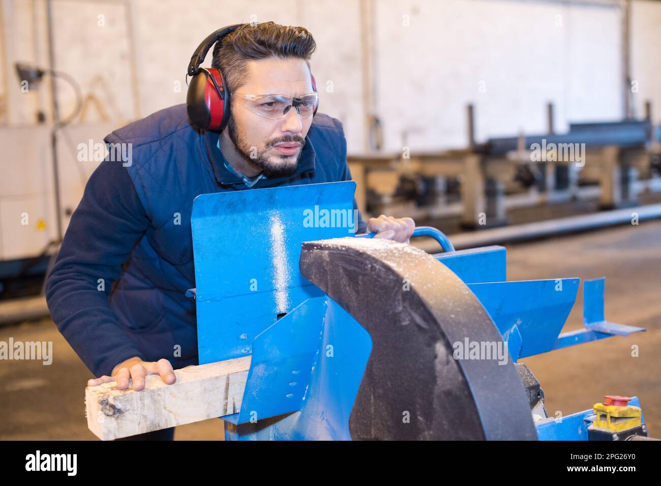 Man Using Saw Man using miter saw to cut wood hi-res stock photography and images - Alamy