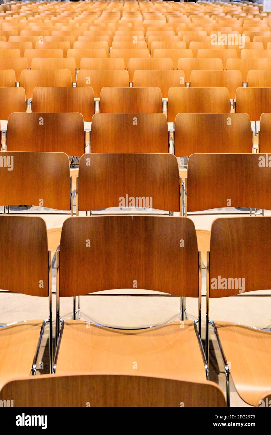 Rows of wooden backed empty seats in a church Stock Photo Alamy
