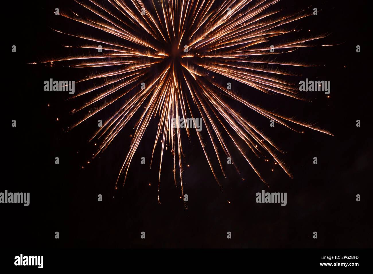 abstract holiday background: bright firework burst against night sky Stock Photo