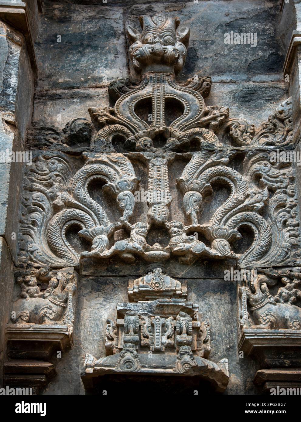 Beautiful carving on the outer walls of Brahma Jinalaya Temple in Lakkundi. It is an early 11th-century Mahavira temple in Gadag District of Karnataka Stock Photo