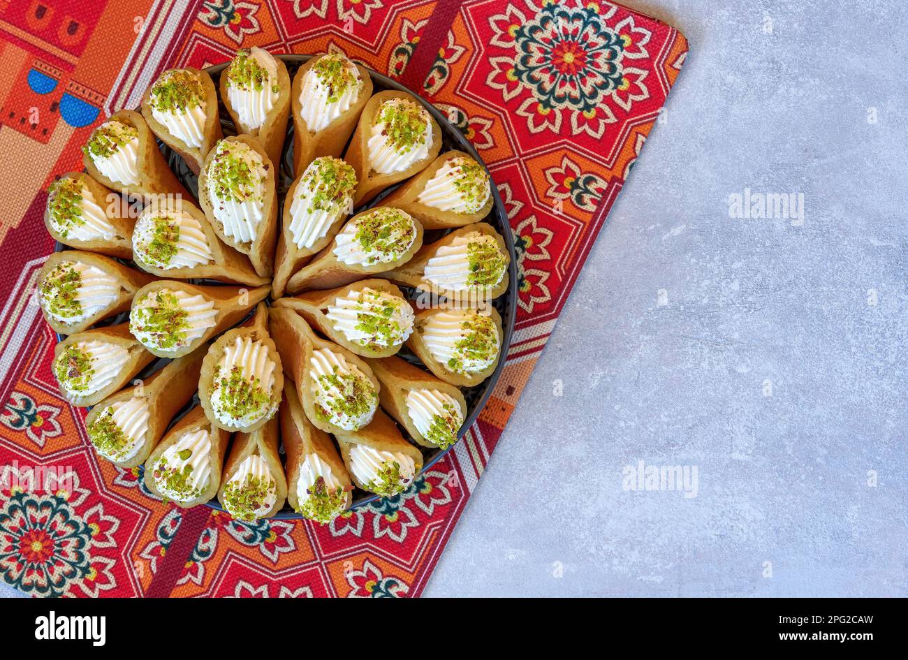 Arabian pancake Qatayef with qishta cream and pistachio . Traditional