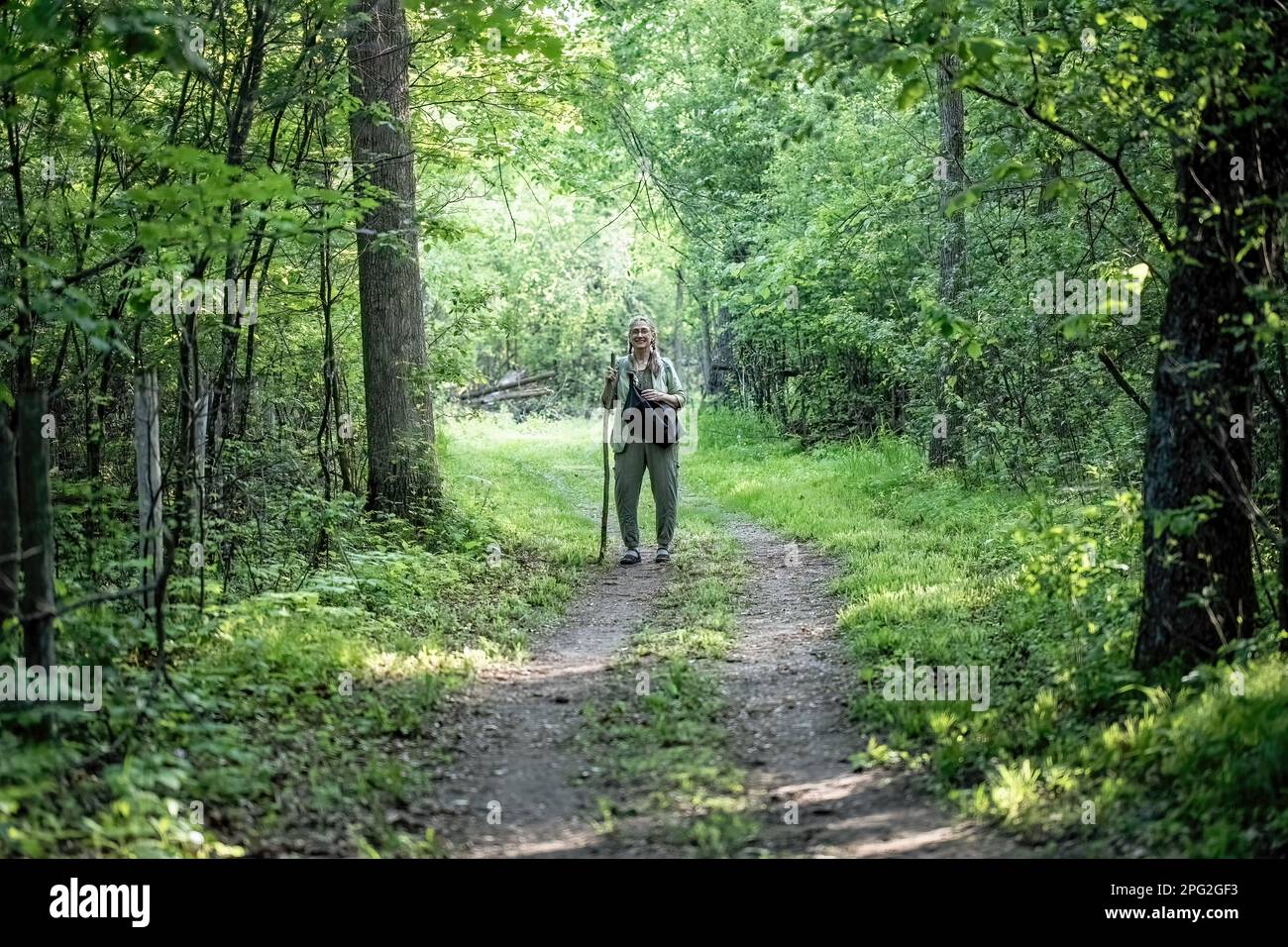 Mature woman in woods hi-res stock photography and images - Alamy