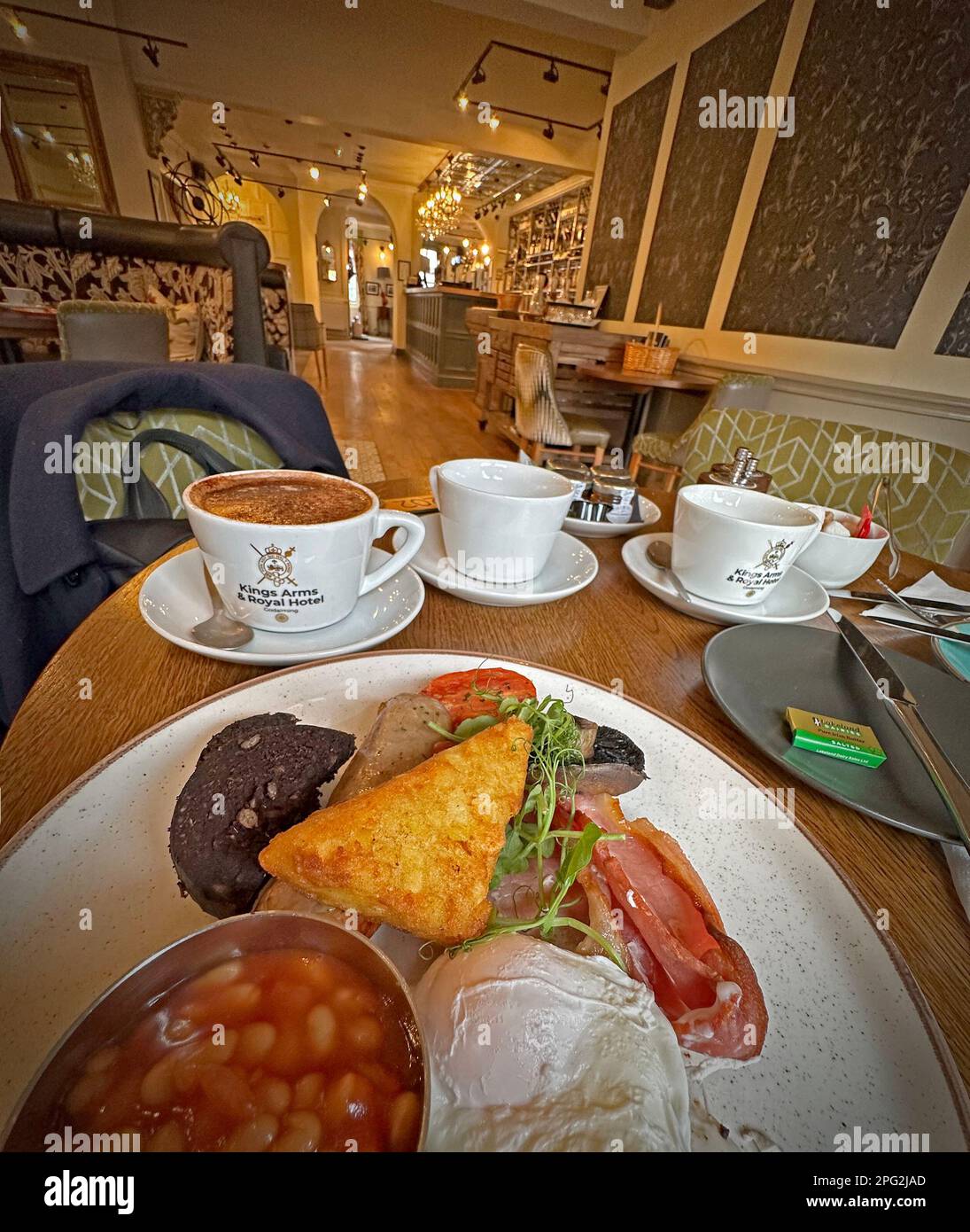 Cooked, full , English, breakfast, sausage, egg, black pudding, eggs, bacon, hash brown, tomato, coffee, at Kings Arms & Royal, Godalming,Surrey,UK Stock Photo