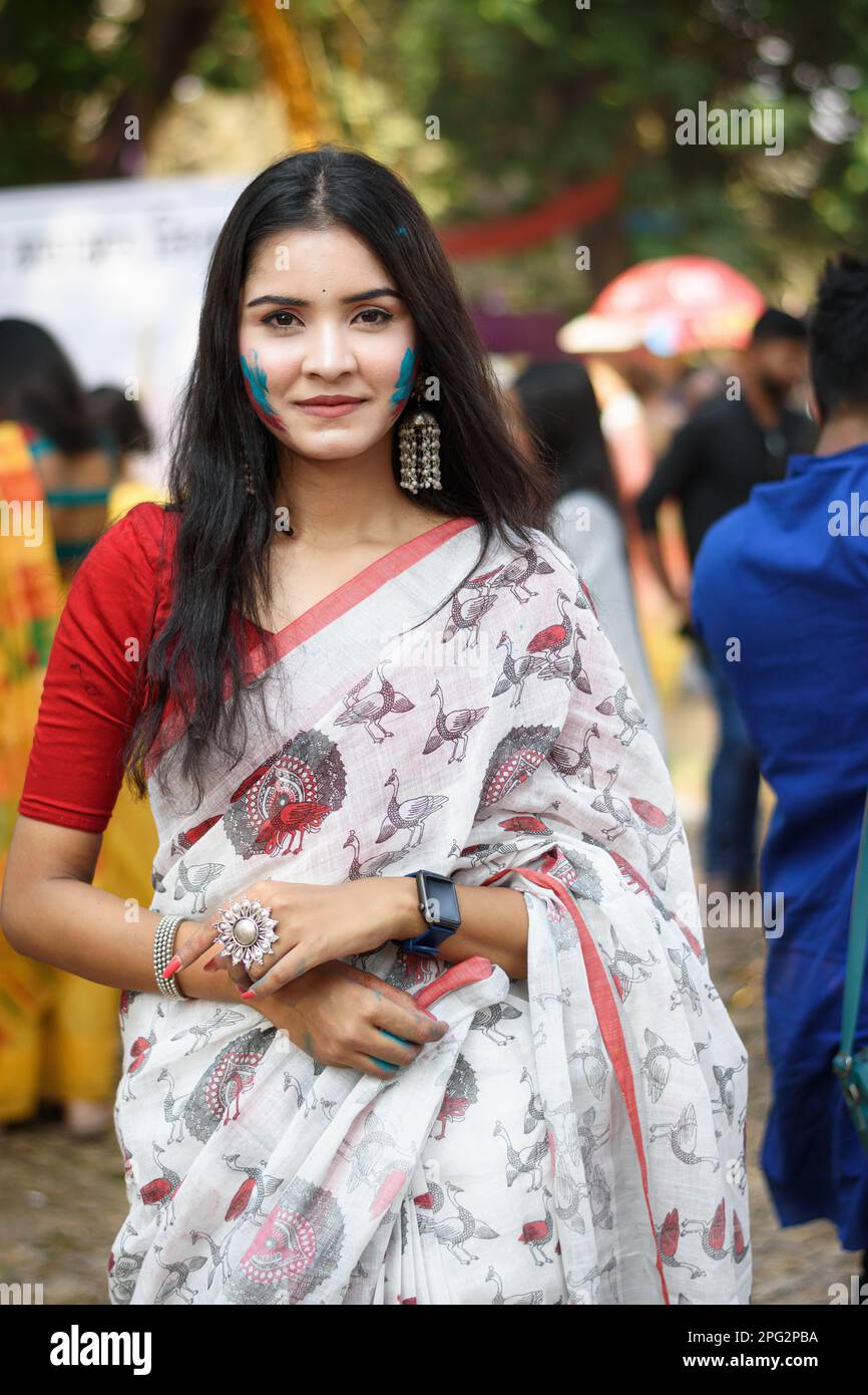Portrait of a pretty young Indian woman wearing traditional saree and ...