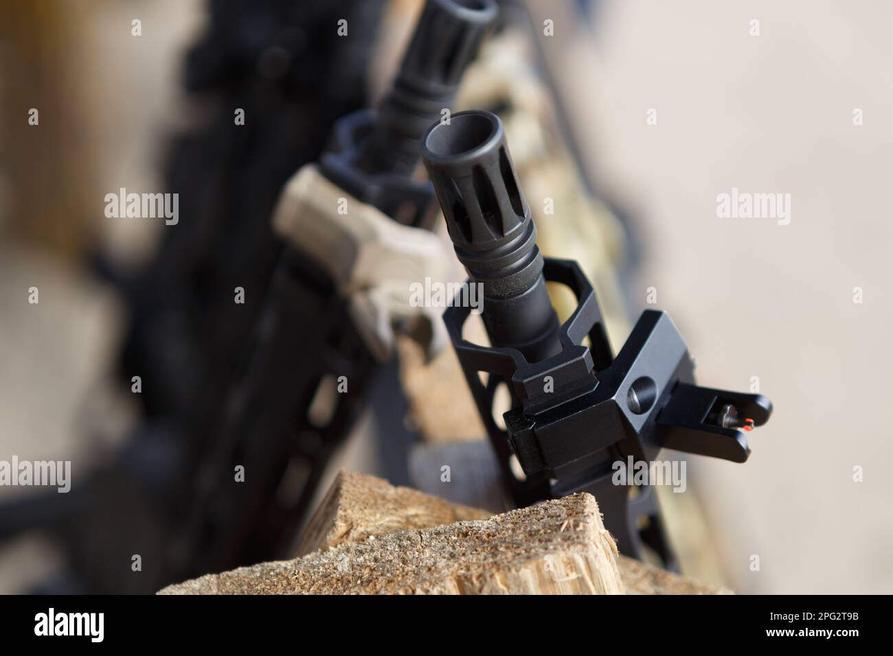 Assault rifles on weapon stand at the shooting range. Modern 5.56mm