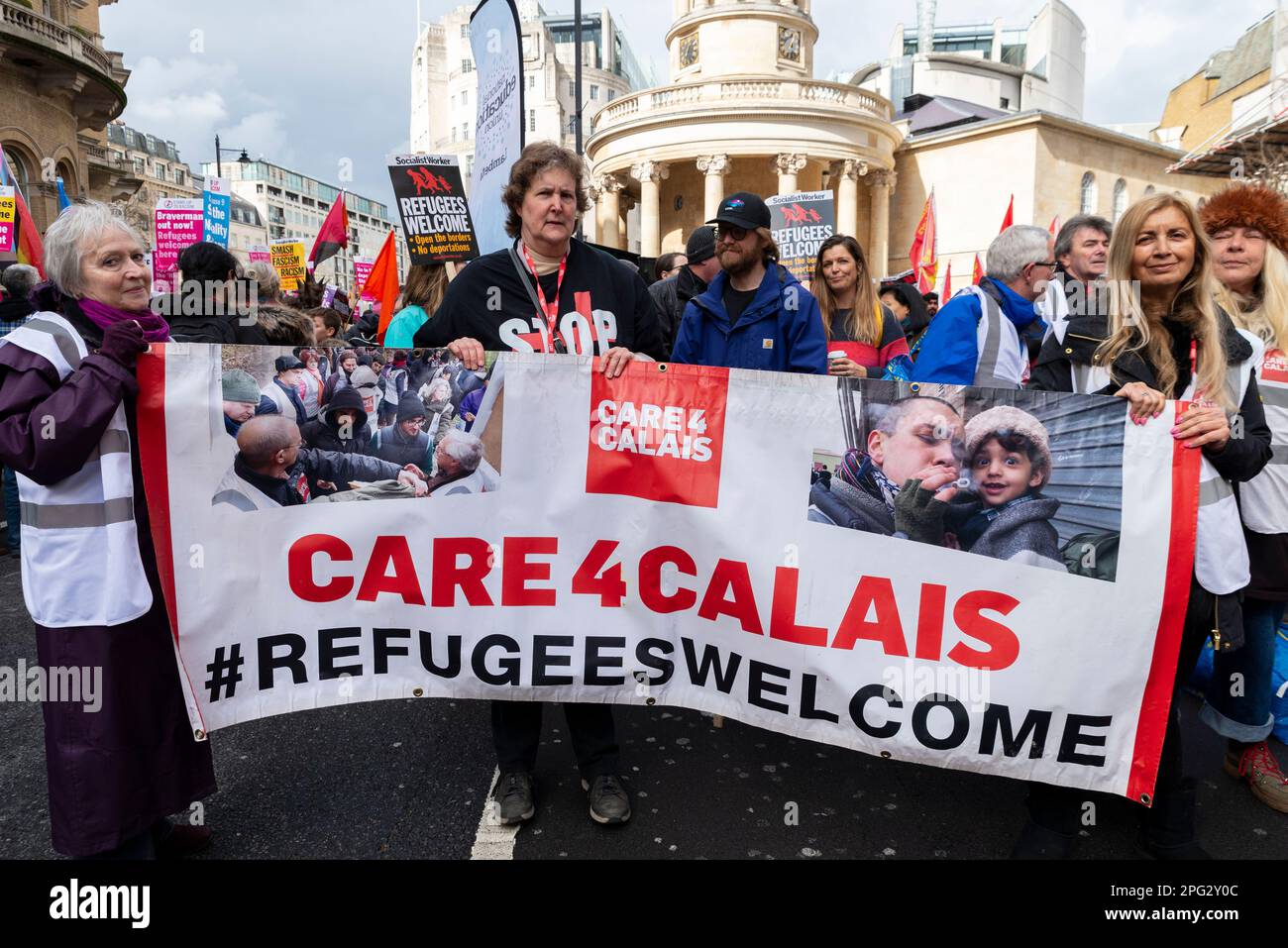 Protest taking place in London on UN Anti Racism Day. Stand up to Racism. Care 4 Calais banner Stock Photo