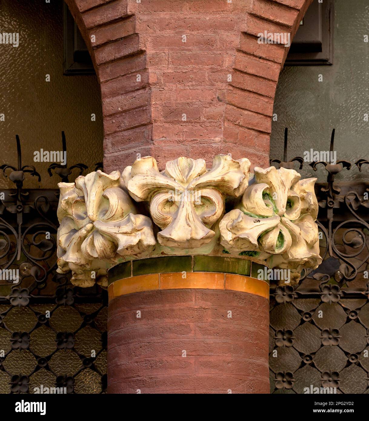 Shot in color and black and white detail on the facade of this historic building representing some character, animal or flower. Set at Barcelona Stock Photo