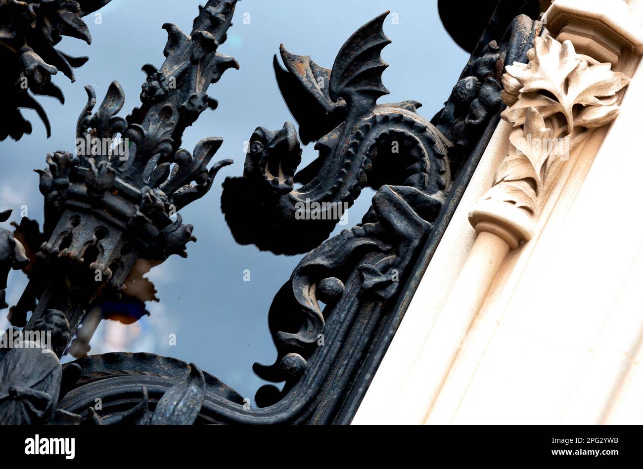 Shot in color and black and white detail on the facade of this historic building representing some character, animal or flower. Set at Barcelona Stock Photo