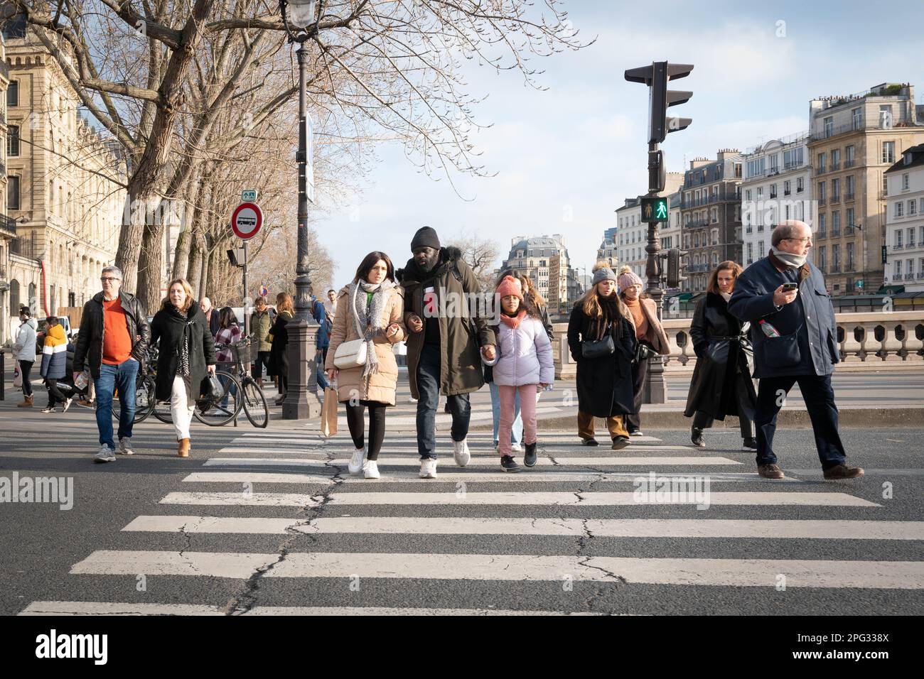 Parisians walking across road on Pont de la Concorde bridge in Paris Stock Photo