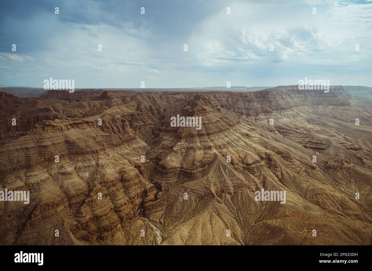 Grand Canyon gorge with blue sky and clouds. View from top of a viewing point. Stock Photo