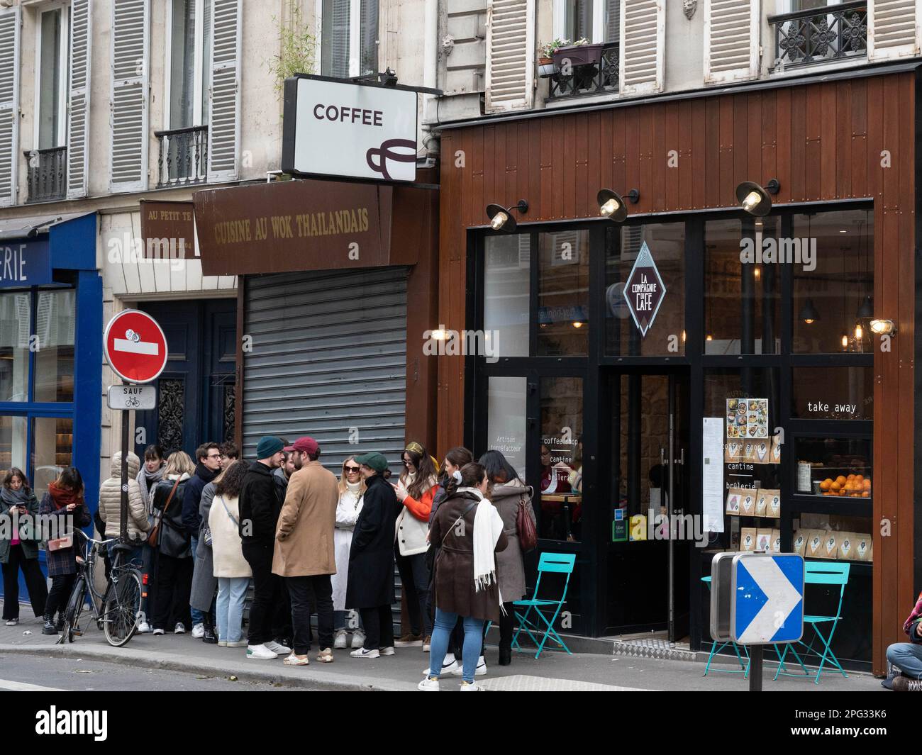 Customers queueing for coffee in trendy Rue des Martyrs in Paris, France Stock Photo