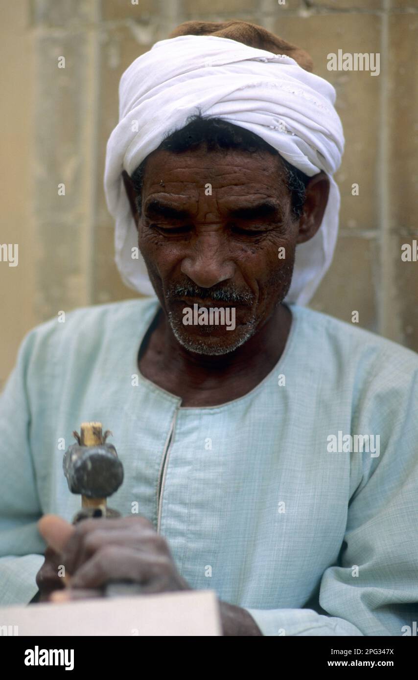 Egypt, Cairo, Egyptian man restoring monument, mason, masonry Stock