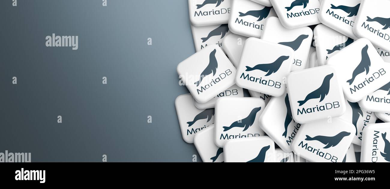 Logos of the open source database system MariaDB (a derivative of MySQL) on a heap on a table. Web banner format, copy space. Stock Photo