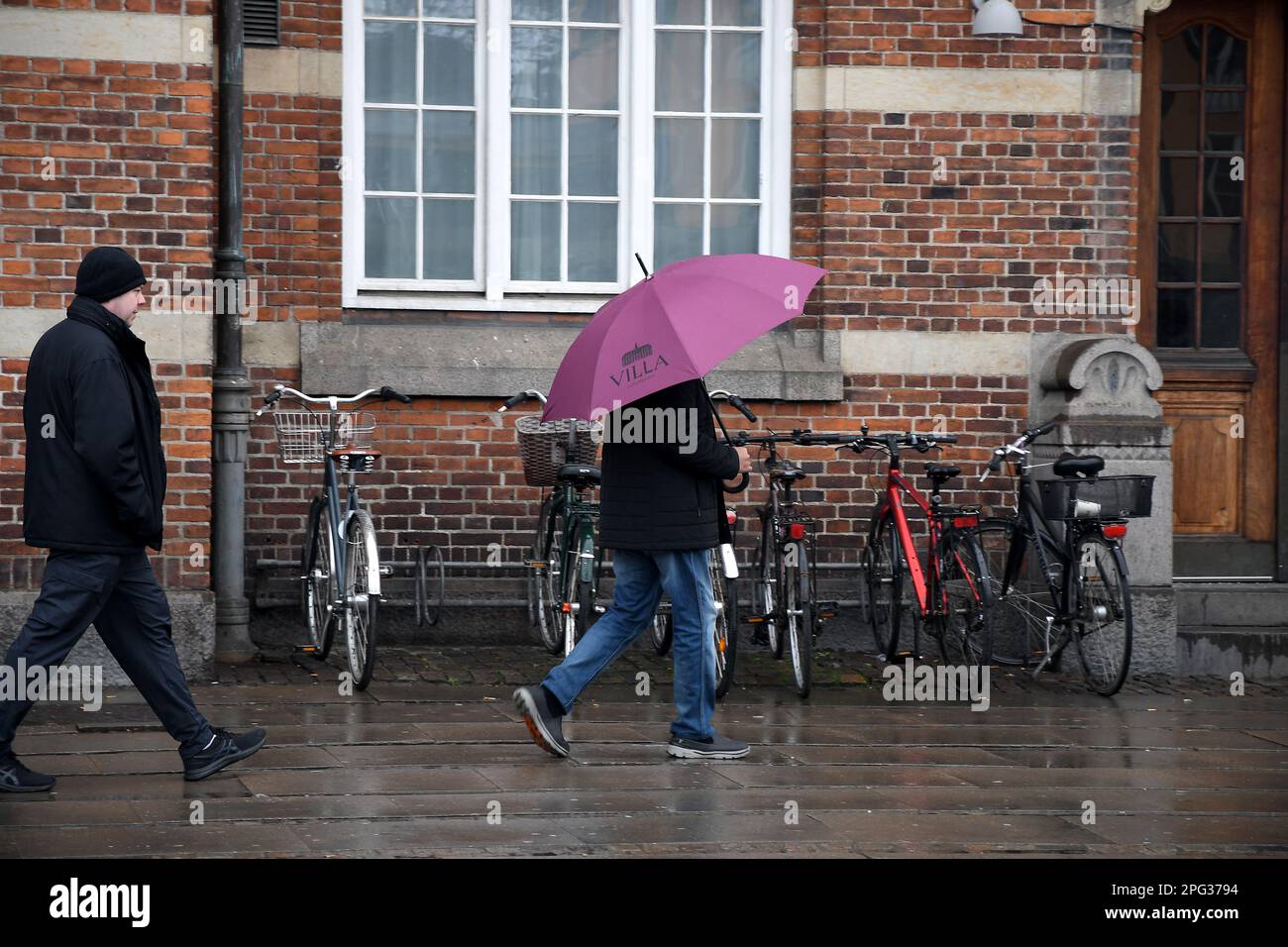 Copenhagen /Denmark/20 March 2023/People use umbrella duering rain fall