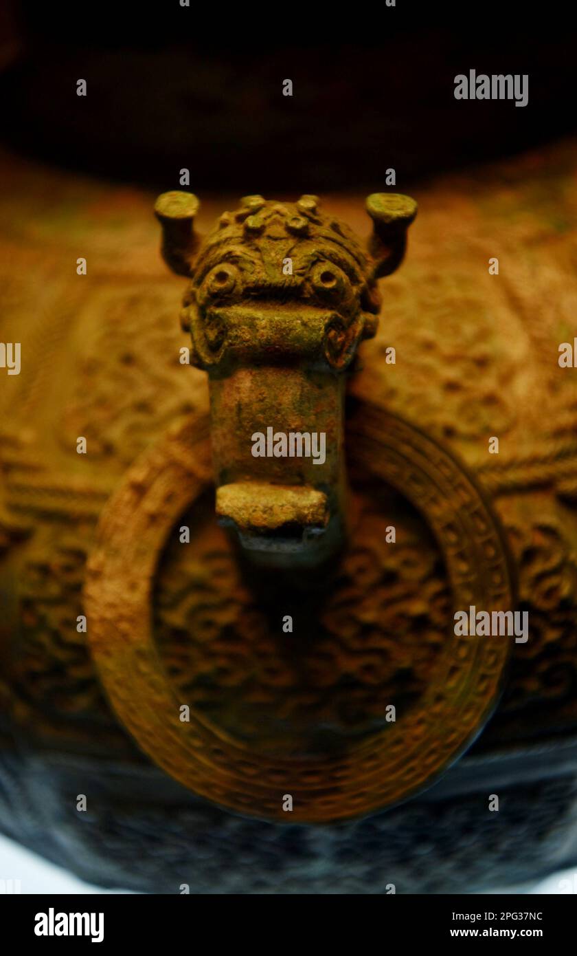 SHIJIAZHUANG, CHINA - MARCH 15, 2023 - The bronze vase of an adder in the Warring States Period on display at the Hebei Provincial Museum, 15 March 20 Stock Photo