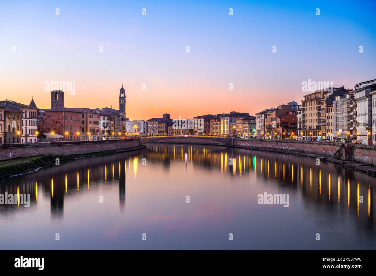 Pisa, Italy skyline on the Arno River at dusk. Stock Photo