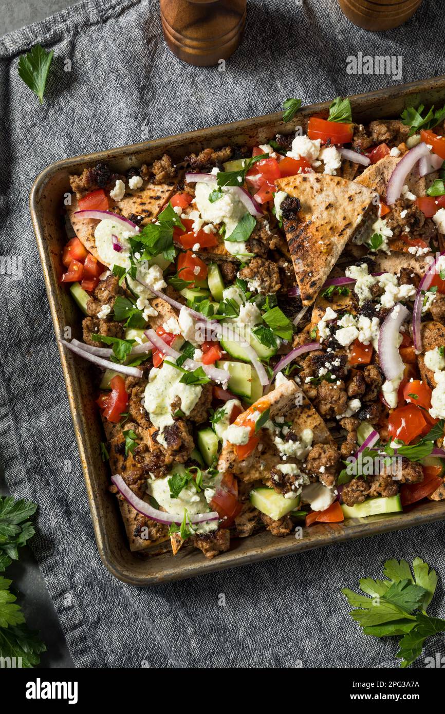 Mediterranean Homemade Pita Nachos with Lamb Hummus Feta and Cucumber